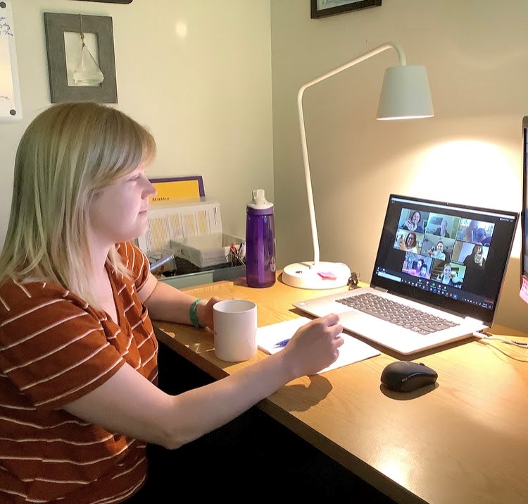 Teacher looking at laptop