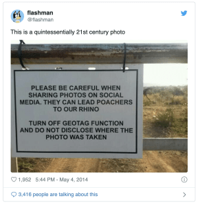 An Instagram image of a warning sign hanging from a metal gate. The sign reads: "Please be careful when sharing photos on social media. they can lead poachers to our rhino. Turn off geotag function and do not disclose where the photo was taken."